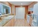 Well-lit kitchen featuring modern appliances and light wood cabinets, open to the living space at 500 Bainbridge Dr, Atlanta, GA 30327