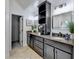 The bathroom features double vanities with granite countertops, providing ample space and a touch of elegance at 1887 Lake Ridge Ter, Lawrenceville, GA 30043