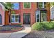 Inviting front entrance showcasing a stylish black door, neat landscaping, and a paved walkway, enhancing curb appeal at 1887 Lake Ridge Ter, Lawrenceville, GA 30043