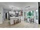 Open concept kitchen with large island, stainless steel appliances, and decorative lighting at 1887 Lake Ridge Ter, Lawrenceville, GA 30043