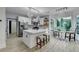 Open concept kitchen with large island, stainless steel appliances, and decorative lighting at 1887 Lake Ridge Ter, Lawrenceville, GA 30043