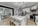Bright kitchen boasts a central island, stainless appliances, and eat-in dining area at 1887 Lake Ridge Ter, Lawrenceville, GA 30043