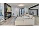 Spacious living room with a fireplace, neutral decor, and an open layout with access to the dining area at 1887 Lake Ridge Ter, Lawrenceville, GA 30043