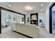 Bright and open living room featuring a fireplace, modern lighting, and a view to a sunroom and bathroom at 1887 Lake Ridge Ter, Lawrenceville, GA 30043