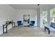 Bright living room features stylish decor, comfortable seating, and large windows for natural light at 1887 Lake Ridge Ter, Lawrenceville, GA 30043