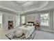 Inviting main bedroom featuring tray ceilings, plush carpet, and ample natural light at 1887 Lake Ridge Ter, Lawrenceville, GA 30043