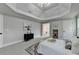 Spacious main bedroom with tray ceiling, plush carpet and elegant decor create a relaxing ambiance at 1887 Lake Ridge Ter, Lawrenceville, GA 30043