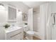 Bright, updated bathroom featuring a shower with white curtain, new vanity, and white walls at 985 Ponce De Leon Ne Ave # 301, Atlanta, GA 30306