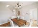 Bright dining room featuring wood table, modern light fixture and staircase at 985 Ponce De Leon Ne Ave, Atlanta, GA 30306