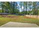 Fenced backyard featuring a patio and grass at 127 Cranbrooke Dr, Dallas, GA 30157