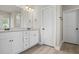Bathroom featuring double vanity with granite countertop and modern fixtures at 127 Cranbrooke Dr, Dallas, GA 30157