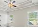 Bright bedroom with a ceiling fan, recessed lighting, and natural light from two windows at 127 Cranbrooke Dr, Dallas, GA 30157