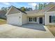 Charming single-story home with a two-car garage and a well-manicured lawn at 127 Cranbrooke Dr, Dallas, GA 30157