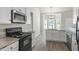 Well-equipped kitchen with granite countertops and stainless steel appliances at 127 Cranbrooke Dr, Dallas, GA 30157