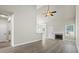 Spacious living room featuring high ceilings, a fireplace, and modern flooring at 127 Cranbrooke Dr, Dallas, GA 30157