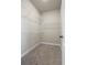 Walk-in closet with carpet features metal shelving for organization at 127 Cranbrooke Dr, Dallas, GA 30157