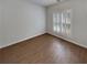 A bright bedroom with hardwood floors and plantation shutters at 253 Yardsley Dr, Mcdonough, GA 30253