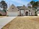 Charming single-Gathering home with a traditional design, attached garage and well-manicured lawn at 253 Yardsley Dr, Mcdonough, GA 30253