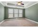 Spacious primary bedroom with natural light, tray ceiling, and plush carpeting at 3066 Quantum Ln # 24, Atlanta, GA 30341