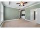 A large bedroom has a ceiling fan, a double door closet, and a built in cabinet at 3066 Quantum Ln # 24, Atlanta, GA 30341