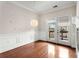 Dining room with hardwood floors, decorative lighting, and French doors opening to a balcony at 3066 Quantum Ln # 24, Atlanta, GA 30341