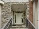 Inviting front entrance with stone and brick accents, framed by stairs with decorative railings at 3066 Quantum Ln # 24, Atlanta, GA 30341