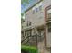 Attractive townhome with a blend of textures, including stone accents and a welcoming entryway at 3066 Quantum Ln # 24, Atlanta, GA 30341