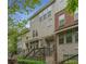 Stylish townhome featuring a combination of stone and stucco facade and landscaped entrance at 3066 Quantum Ln # 24, Atlanta, GA 30341