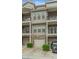 Townhome with private garage, balconies, and neutral facade for a modern living experience at 3066 Quantum Ln # 24, Atlanta, GA 30341