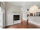 Living room area with fireplace, hardwood floors, and an open view into the adjacent kitchen at 3066 Quantum Ln # 24, Atlanta, GA 30341