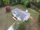 Aerial view of a two-story home with a well-manicured lawn and mature trees at 3529 Riverview Approach, Ellenwood, GA 30294