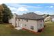 Exterior view showcasing the home's spacious backyard with lush trees at 3529 Riverview Approach, Ellenwood, GA 30294