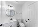 Updated bathroom with modern vanity and lighting at 3529 Riverview Approach, Ellenwood, GA 30294