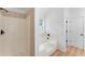 Bright bathroom featuring a shower and separate tub at 3529 Riverview Approach, Ellenwood, GA 30294