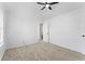 Comfortable bedroom with neutral carpet, a modern ceiling fan, and access to an adjoining bathroom for convenience at 3529 Riverview Approach, Ellenwood, GA 30294