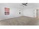Bright bedroom with large windows offering natural light and a modern ceiling fan for added comfort and style at 3529 Riverview Approach, Ellenwood, GA 30294