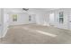 Bright bedroom featuring a modern ceiling fan, neutral carpeting, and two windows offering natural light at 3529 Riverview Approach, Ellenwood, GA 30294