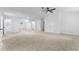 Large bedroom showcasing neutral carpet, modern ceiling fan, and multiple closets, perfect for ample storage at 3529 Riverview Approach, Ellenwood, GA 30294