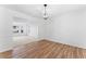 Dining room showcasing hardwood floors and open access to the carpeted living room at 3529 Riverview Approach, Ellenwood, GA 30294