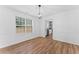 Dining room with hardwood floors, wainscoting, and views of the kitchen at 3529 Riverview Approach, Ellenwood, GA 30294