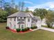 Attractive two-story home with a well-maintained lawn and two-car garage at 3529 Riverview Approach, Ellenwood, GA 30294