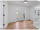 Spacious foyer boasts hardwood floors, a bright white front door and adjacent stairwell at 3529 Riverview Approach, Ellenwood, GA 30294