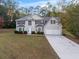 Charming two-story home with a manicured lawn and a two-car garage at 3529 Riverview Approach, Ellenwood, GA 30294