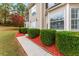 Close-up of a home's front yard featuring manicured hedges and a sidewalk at 3529 Riverview Approach, Ellenwood, GA 30294