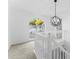 Bright hallway featuring a modern globe chandelier and an arched window, enhancing the home's appeal at 3529 Riverview Approach, Ellenwood, GA 30294