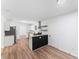 Bright kitchen with stainless steel appliances, island, and wood-look floors at 3529 Riverview Approach, Ellenwood, GA 30294