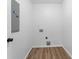 Spacious laundry room with wood-look floors at 3529 Riverview Approach, Ellenwood, GA 30294