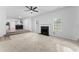 Bright open concept living room with fireplace and wood-look flooring at 3529 Riverview Approach, Ellenwood, GA 30294