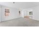 Bright living room with neutral carpet and multiple windows for ample natural light at 3529 Riverview Approach, Ellenwood, GA 30294