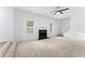 Bright living room with fireplace and carpet at 3529 Riverview Approach, Ellenwood, GA 30294